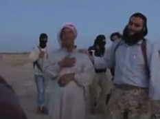 İŞİD vəhşiliyi: ata qızını daşqalaq etdi - VİDEO