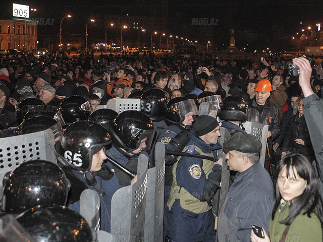 Policemen block pro-Russian protesters near the regional administrative building in Kharkiv